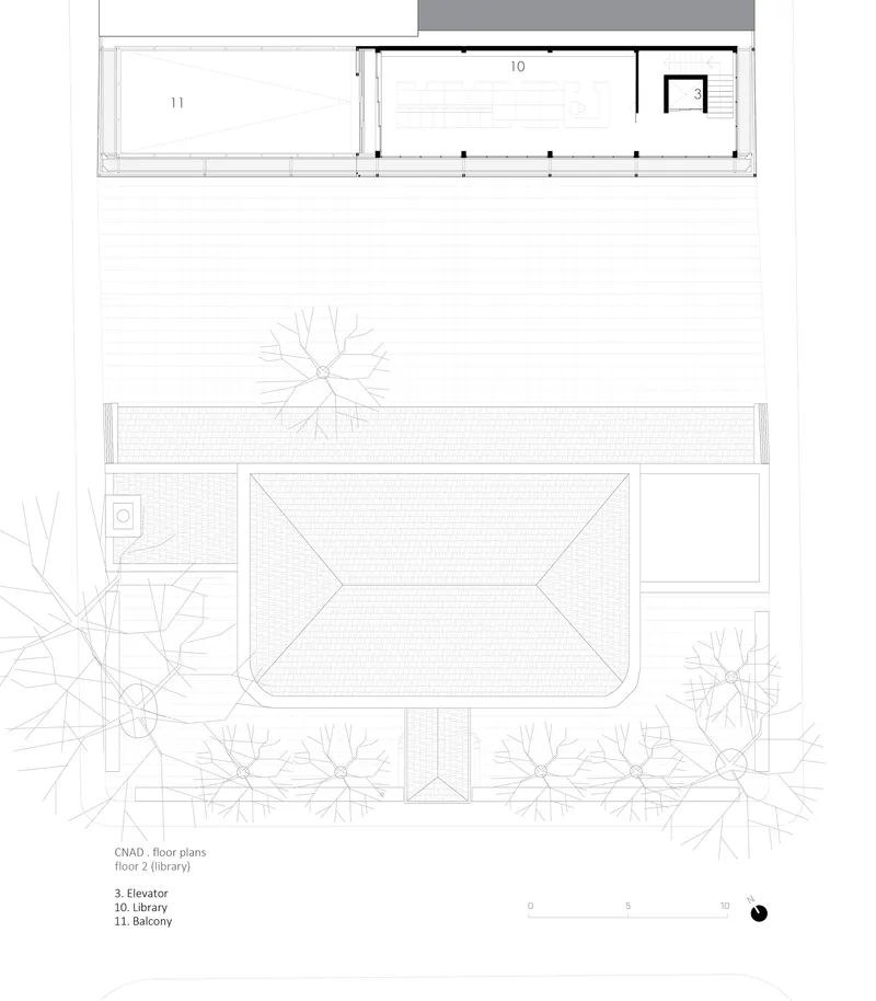 Second floor plan drawing showing library space with balcony and elevator core