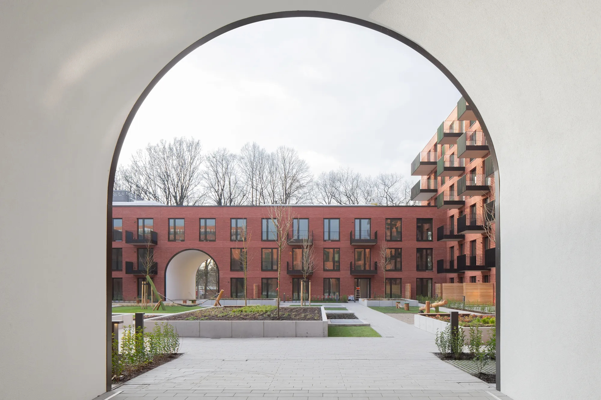 blrm Architekt*innen Wraps a Hamburg Block in Clinker Brick and Round Arches