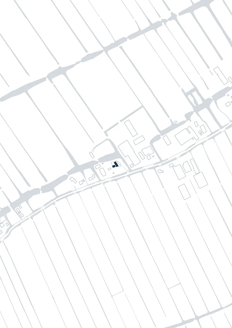 Site plan drawing showing building footprints along a diagonal street with a highlighted structure