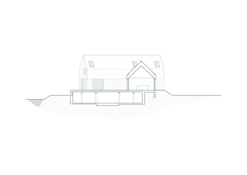 Section drawing showing gabled house form with lower level partially embedded in sloping terrain