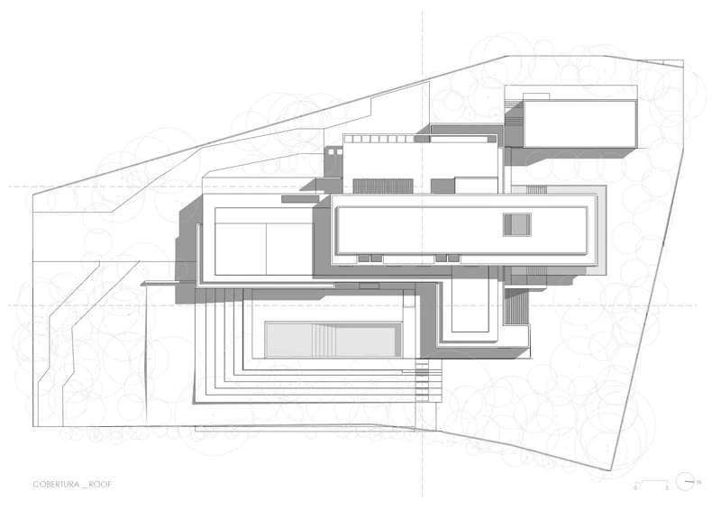 Roof plan drawing showing overlapping rectangular volumes arranged on a sloping site with contour lines