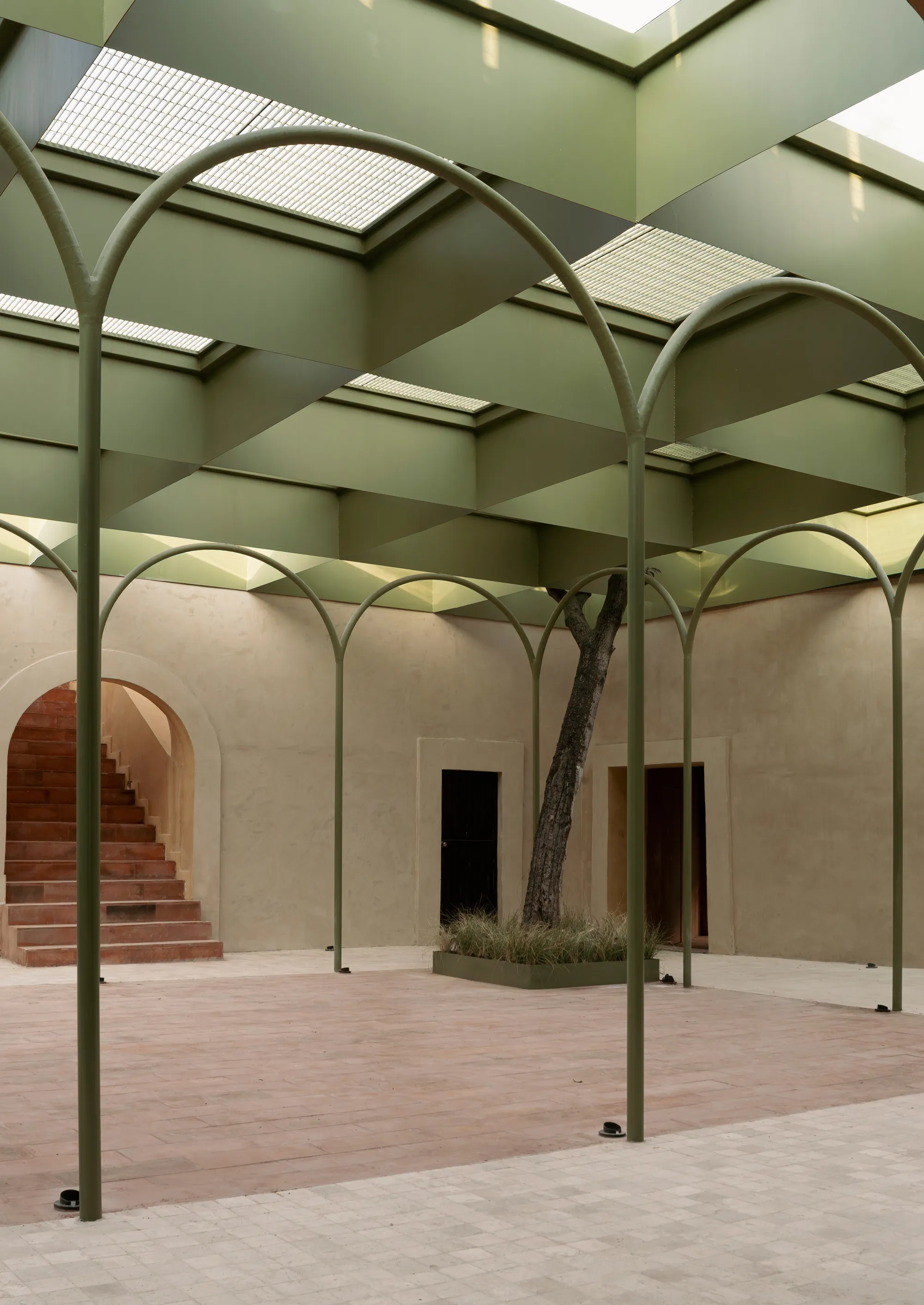 OMAC Arquitectos Restores a 19th-Century Bernal Courtyard into a Skylit Shopping Center