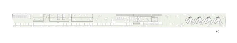 Floor plan drawing showing a linear arrangement of rooms with four units at the eastern end