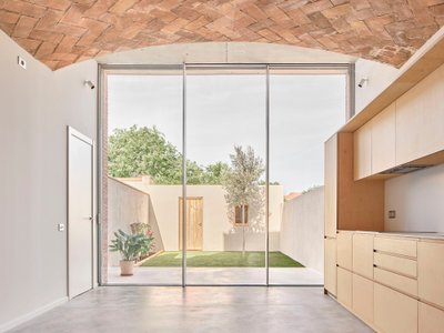 Pineda Monedero Hollows Out a 1900 Sabadell Row House and Lets the Courtyard Back In