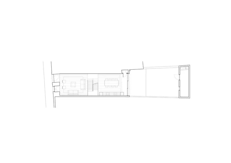 Ground floor plan drawing showing living and dining zones with central stair and courtyard