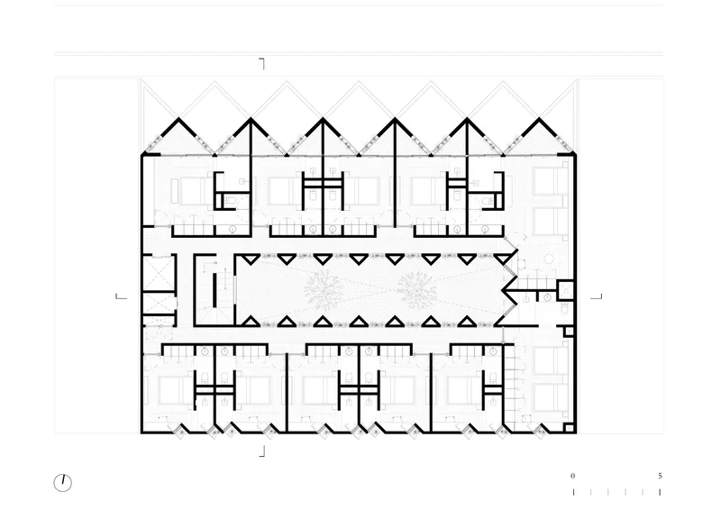 Floor plan drawing showing residential units with sawtooth roofline flanking a central courtyard and circulation corridor