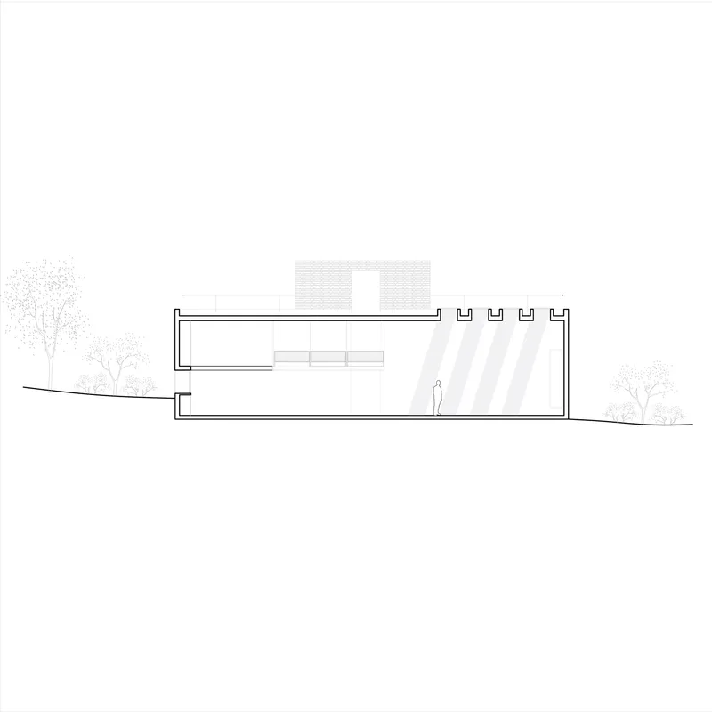 Section drawing showing a two-level structure with rooftop parapets and a human figure for scale
