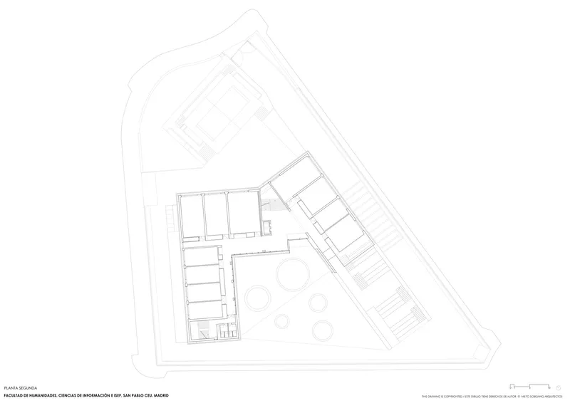 Second floor plan drawing showing circular elements in the central courtyard between two angled wings
