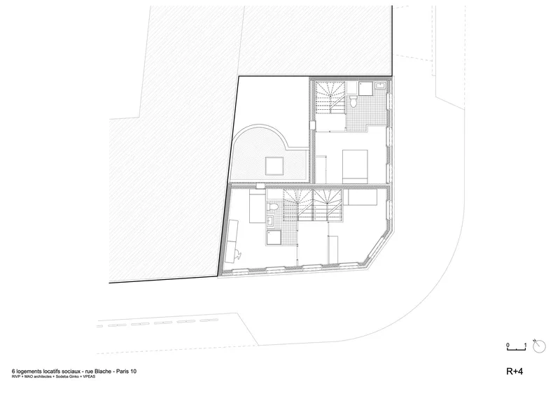 Fourth floor plan drawing showing two bedroom suites separated by central stair volumes