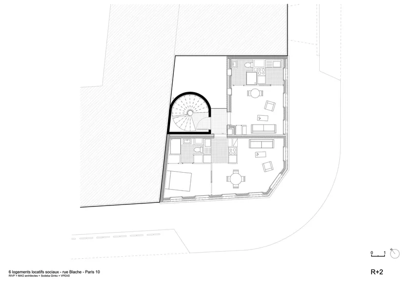 Second floor plan drawing showing duplex living areas with kitchen and spiral stair element