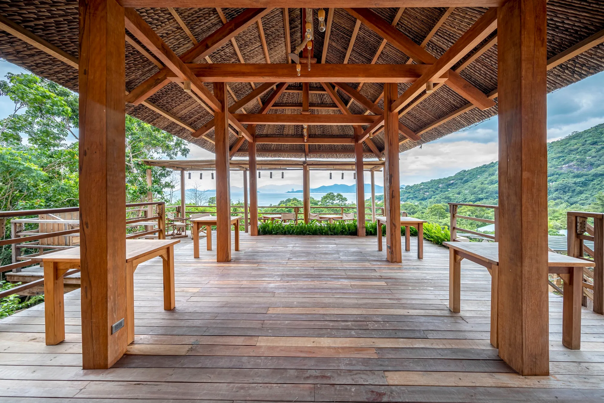 Chi.Arch Nests a Hillside Bar into Vietnamese Rock and Forest with Nothing but Wood and Coconut Leaf
