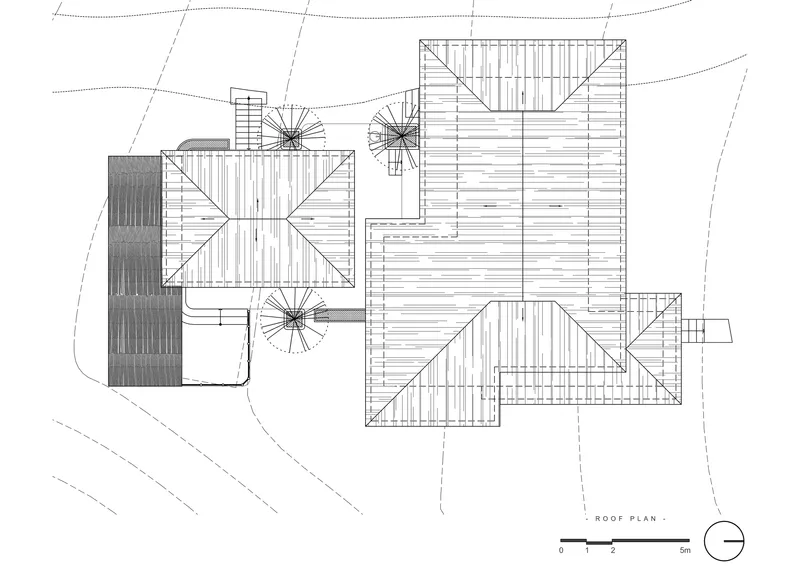 Roof plan drawing showing multiple gabled volumes with diagonal hatching and spiral stair symbols