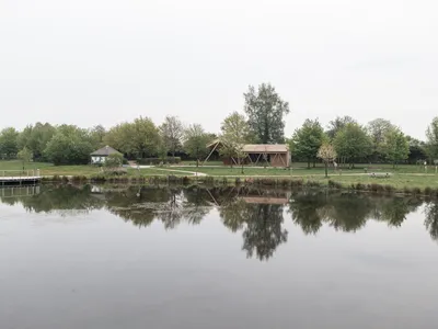Atelier MA Builds a Twisting Timber Pavilion at the Edge of a French Forest Pond