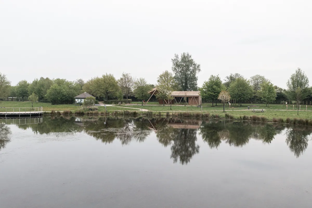 Atelier MA Builds a Twisting Timber Pavilion at the Edge of a French Forest Pond