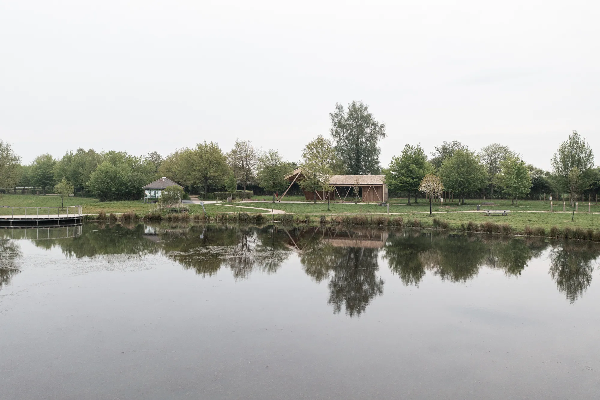 Atelier MA Builds a Twisting Timber Pavilion at the Edge of a French Forest Pond