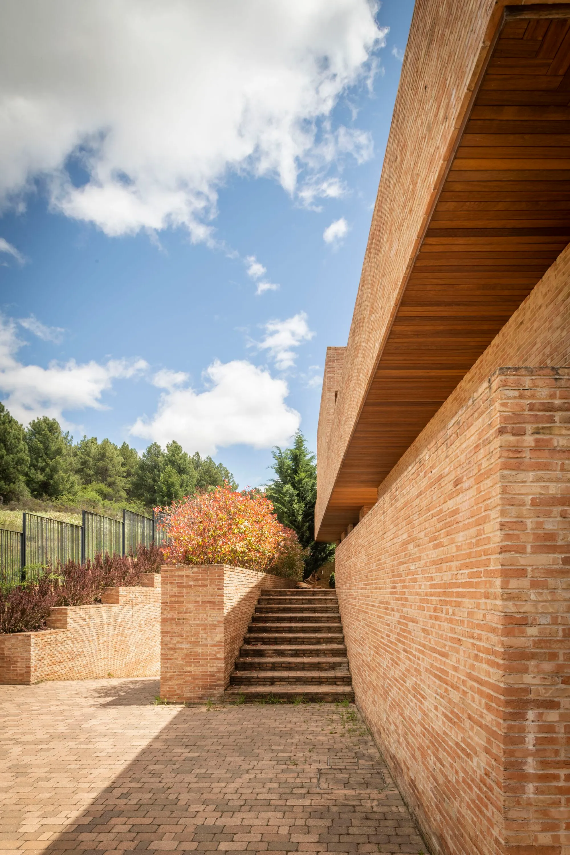 Rodrigo Nuñez Arquitectos Terraces a 900 m² Brick House into a Forest Edge in León