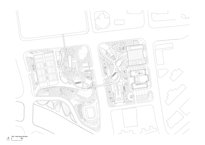 Site plan drawing showing multiple buildings within landscaped grounds and surrounding street grid