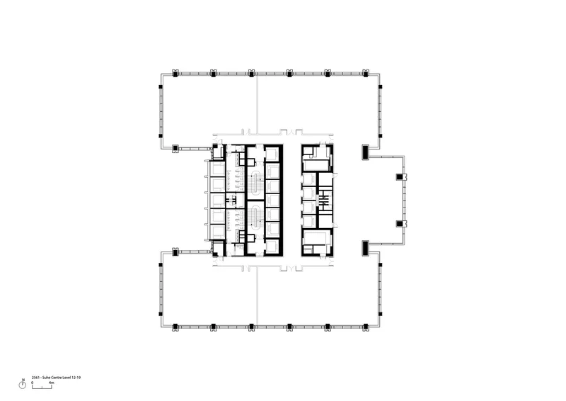 Floor plan showing central core with stairwells flanked by linear room arrangements and perimeter columns