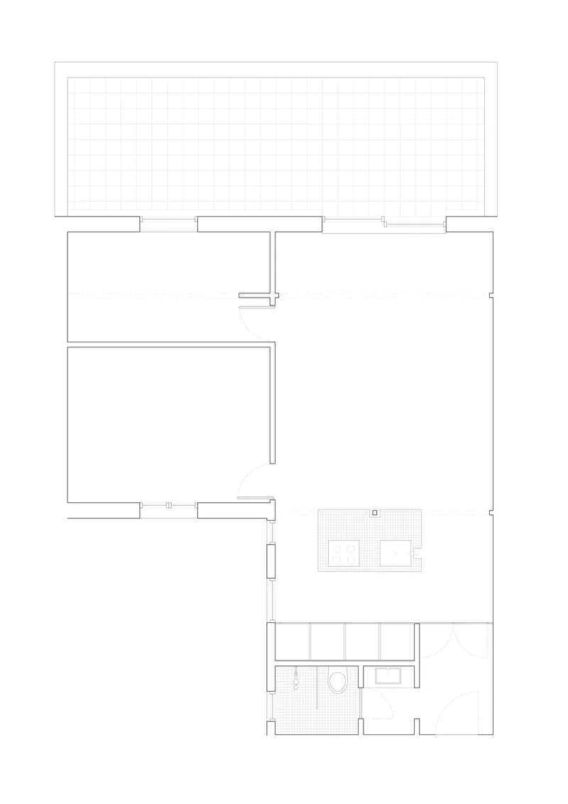 Floor plan drawing showing an open living area with kitchen and bathroom zones