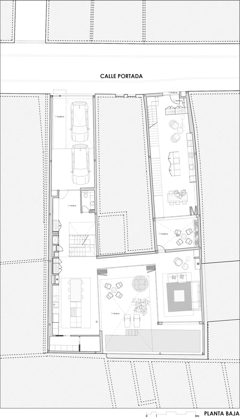 Ground floor plan drawing showing garage spaces, courtyard, and living areas with furniture layout