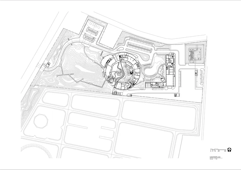 Site plan drawing showing a circular building with radiating wings set within a landscape with topographic contours