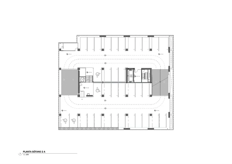 Floor plan showing underground parking level with curved ramps and central core with two staircases