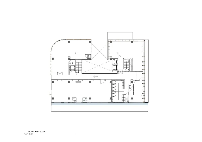 Second level floor plan showing central skylit atrium with diagonal bracing and elevator cores