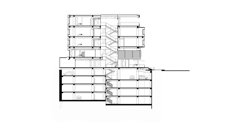 Section drawing revealing a diagonal staircase connecting multiple floor levels in an angular building