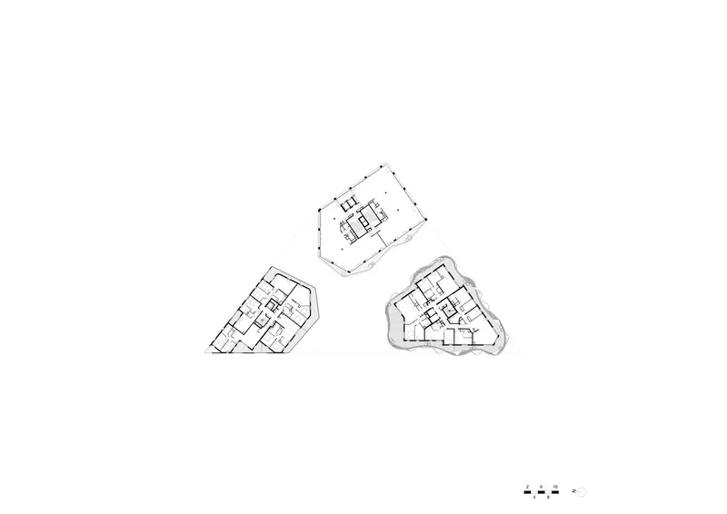 Floor plan drawing showing three separate residential units with angular perimeters and central core configurations