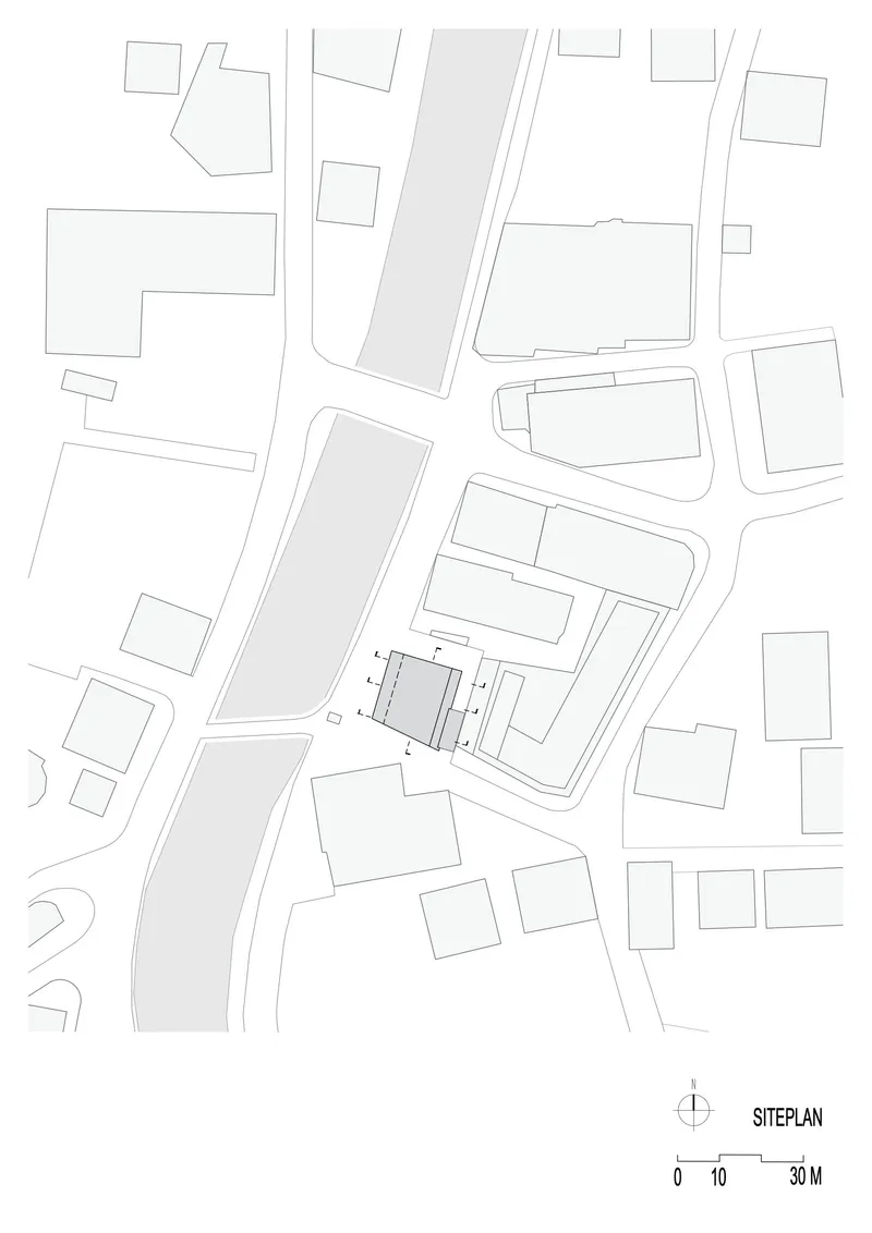 Site plan drawing showing building footprint and street layout in the surrounding urban context