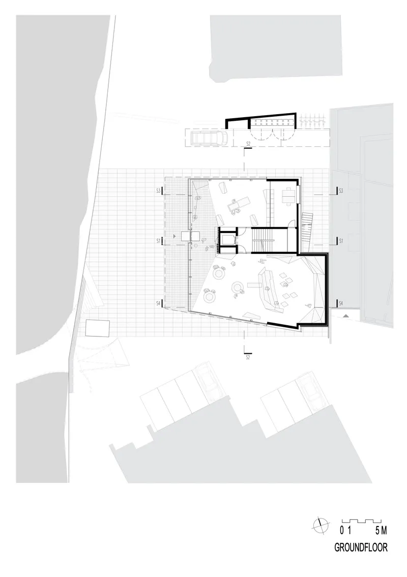 Ground floor plan drawing showing interior layout with terrace, stairs, and adjacent parking area