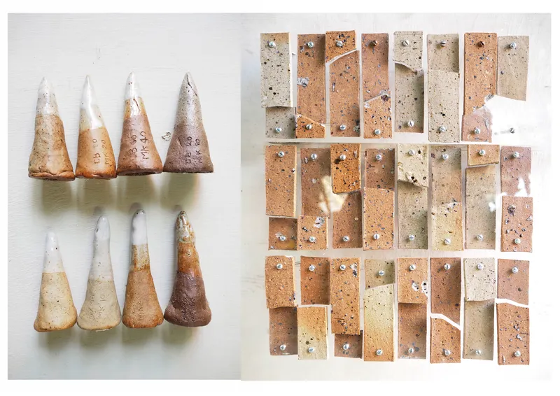 Array of conical ceramic test samples and rectangular tile specimens displaying color and aggregate variations