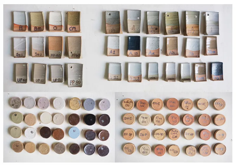 Grid of labeled ceramic test samples showing layered glazes and clay body formulations