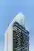 Architects 49 Wraps a 23-Story Pattaya Tower in Vertical Fins and Living Greenery