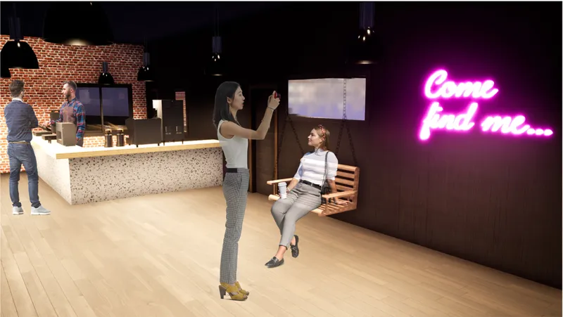 Interior view showing the cafe counter, swing seating, and playful neon signage for social interaction.
