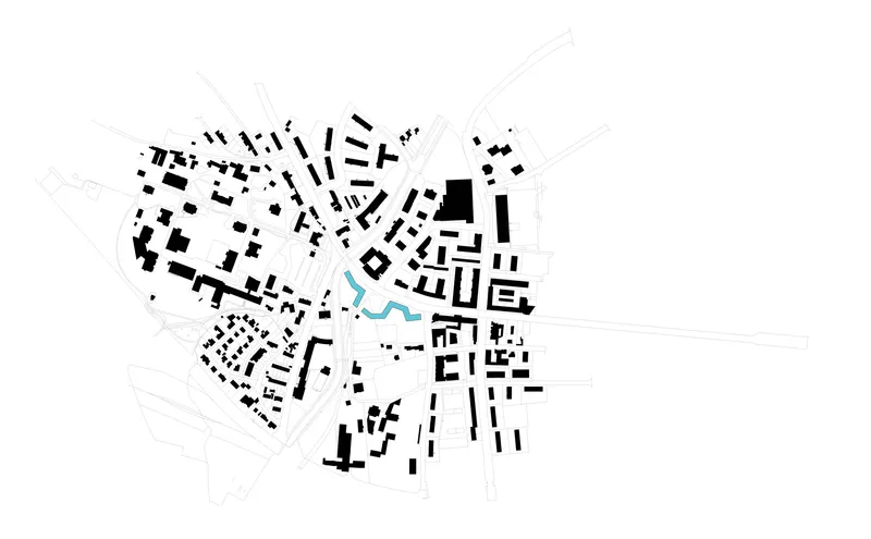 Urban context plan highlighting the site in blue amid the surrounding street grid and buildings