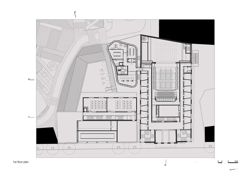 First floor plan drawing depicting upper level of auditorium with balcony seating and surrounding support spaces