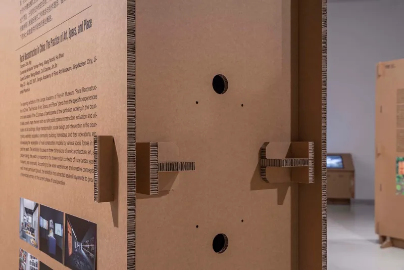 Detail of corrugated cardboard edge with cantilevered shelf brackets and circular cable ports