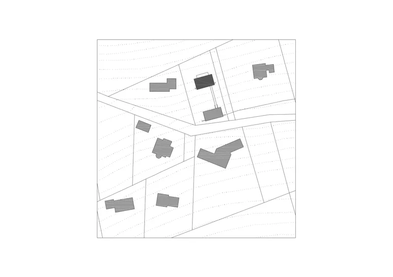 Site plan drawing showing building footprints and parcel boundaries along curved roadways