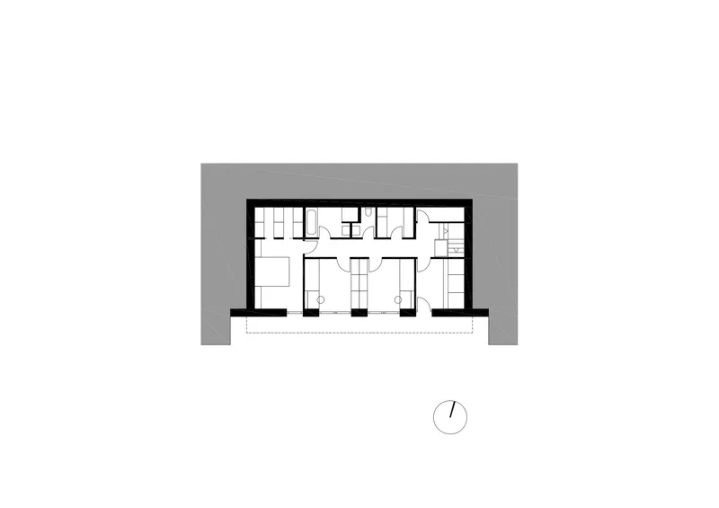 Floor plan drawing of the lower level with bedroom suites and central corridor