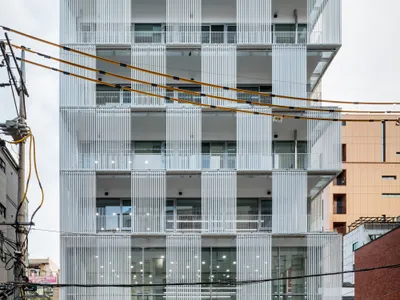 Hyunjoon Yoo and Partners Wrap a Seoul Office Tower in a Metal Curtain That Gives Away 15% of Its Envelope