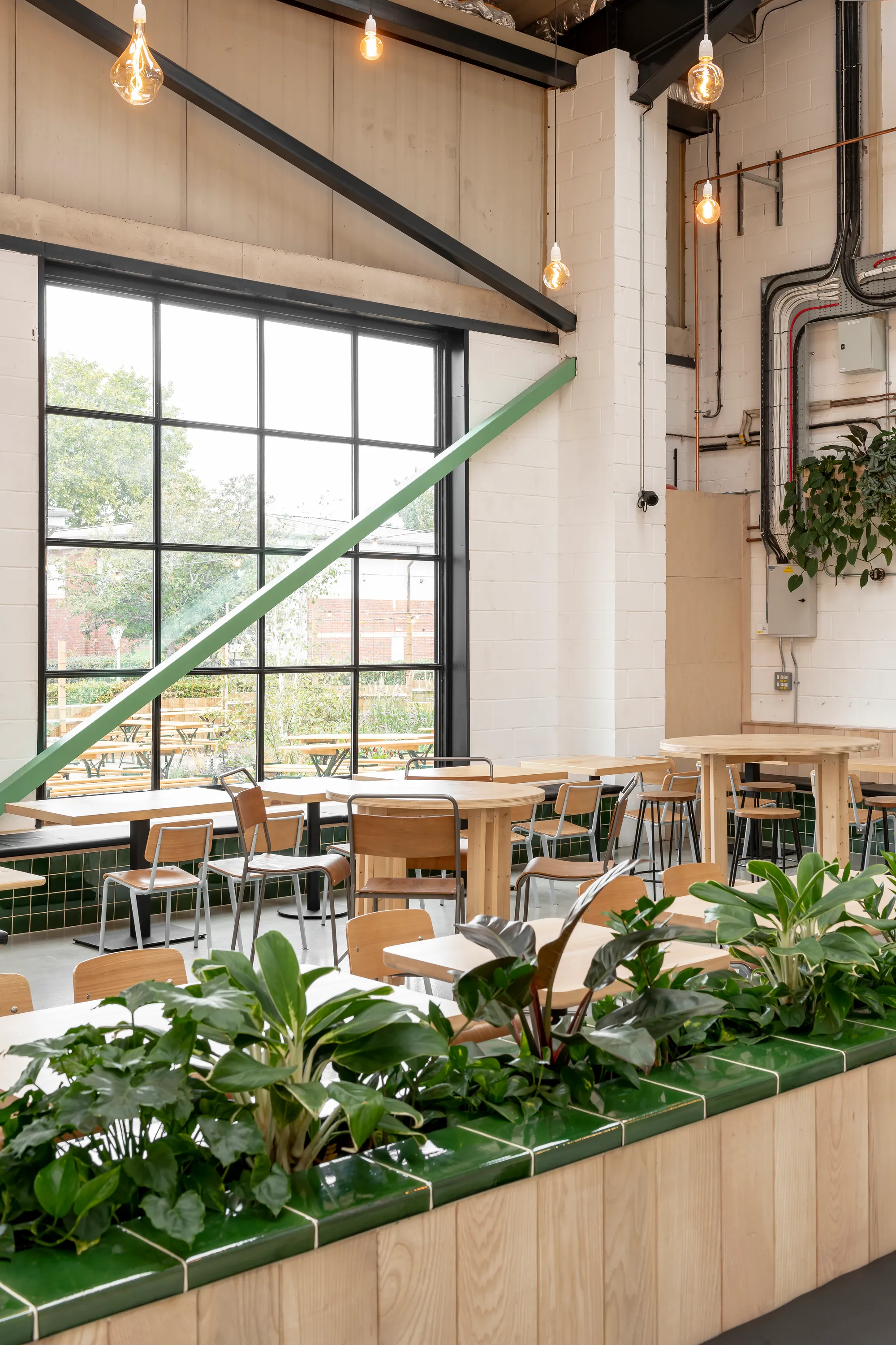 Studio B Wraps a Working Brewery in Mint Green Steel and Local Ash for Wiper and True's Bristol Taproom