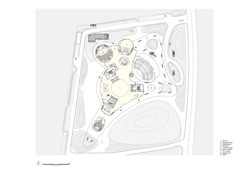 Site plan drawing showing circular and oval building volumes arranged within a landscaped perimeter