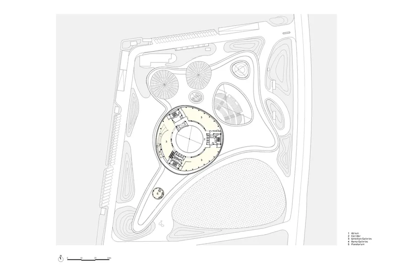 Site plan drawing highlighting one circular building volume within the overall compound