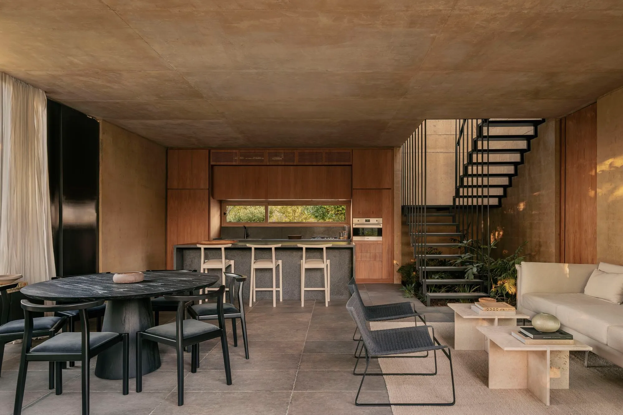 Gonzalo Bardach Shapes a Buenos Aires Dwelling from Pigmented Concrete, Timber and Filtered Light