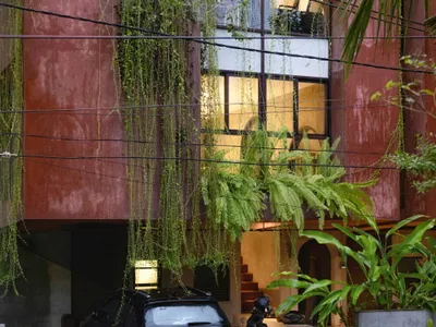 SOHO Architects Stacks Work and Living into a Pink Twin Block on a Tiny Plot in Calicut