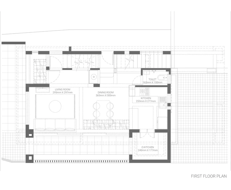 First floor plan drawing showing living room, dining room, kitchen and toilet with outdoor terrace