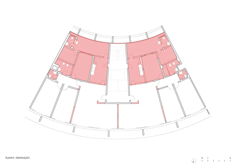 Demolition plan highlighting removed interior partitions in pink within the curved floor plate