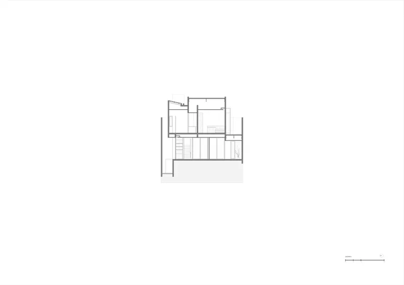Section drawing revealing interior spatial relationships across multiple levels with a central staircase