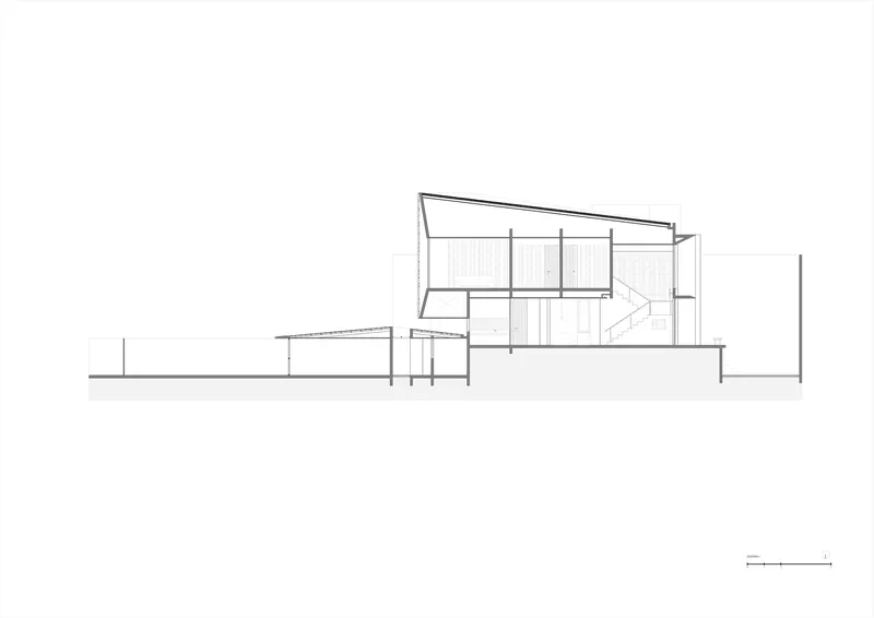 Longitudinal section drawing showing the sloped roof volume and connected horizontal wing